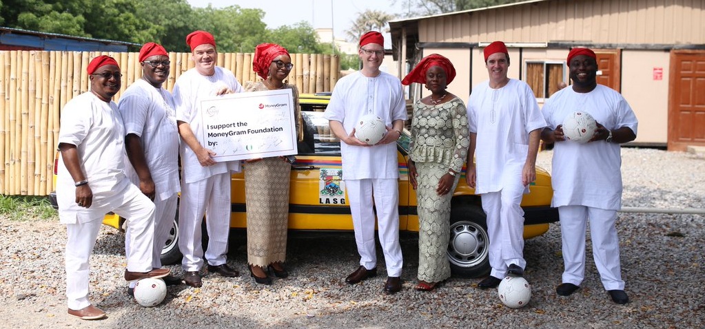 Alex Holmes, MoneyGram Global CEO (4th from right), and the Lagos MoneyGram management team supporting the MoneyGram Foundation charitable activities in Lagos, 2016. During a visit to Frankfurt recently to open the new office of his company, Holmes reiterated that Nigeria and Africa were very important to MoneyGram / © MoneyGram Foundation