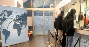 Clients at a branch of an international money transfer company. Remittances are a major part of transnational family support/Photo: AfricanCourierMedia