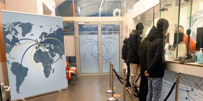 Clients at a branch of an international money transfer company. Remittances are a major part of transnational family support/Photo: AfricanCourierMedia